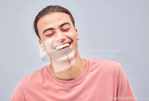 Image of Man, face or laughing on isolated background at funny joke, meme or comedy on grey mockup, model wall or mock up backdrop. Smile, happy or comic student in fashion, trendy style or cool relax clothes