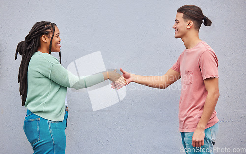 Image of Friends, handshake or meeting on isolated background in collaboration, teamwork mockup or partnership support. Smile, happy or shaking hands for man, black woman or students in relax fashion clothes