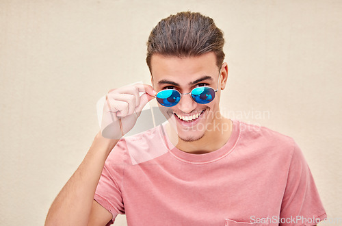 Image of Man, portrait or fashion sunglasses on isolated background for advertising branding, sales deal or flirty mockup marketing. Smile, happy or student model in summer optician vision for eyes healthcare