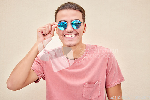 Image of Man, face and retro fashion sunglasses on isolated background for marketing branding, optometry sales or mock up. Smile, happy and model student and summer optician vision or eyes healthcare wellness