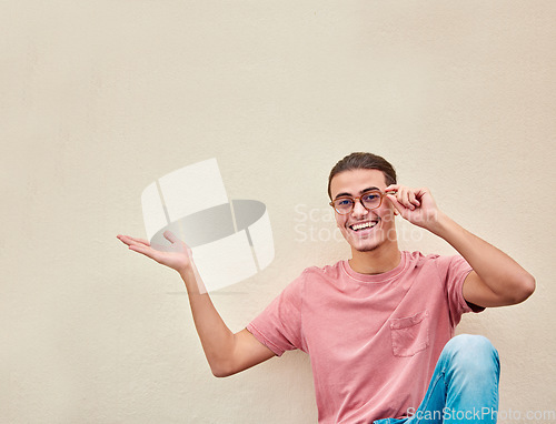 Image of Mockup, hands and portrait of man pointing to space for advertising, empty and studio wall background. Face, hand gesture by guy relax, happy and smile for product placement, marketing or copy space