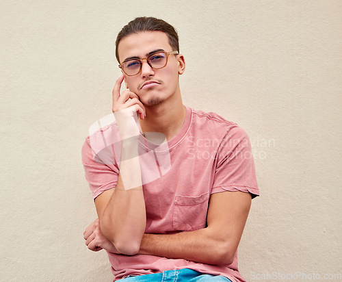 Image of Thinking, portrait and confused man on mockup in studio for advertising, wall background or space. Face, doubt and male pensive, thoughtful and puzzled on copy space, unsure or emoji gesture isolated