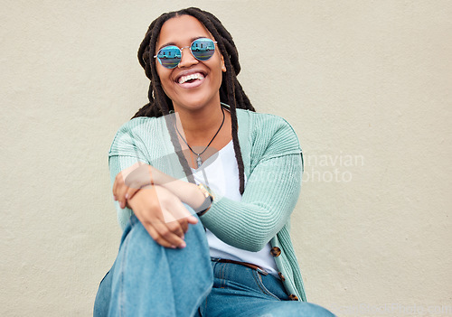 Image of Black woman, sunglasses and city by wall for portrait, happy and smile with fashion in summer. Young gen z, african student girl and outdoor for travel, urban adventure and aesthetic with happiness