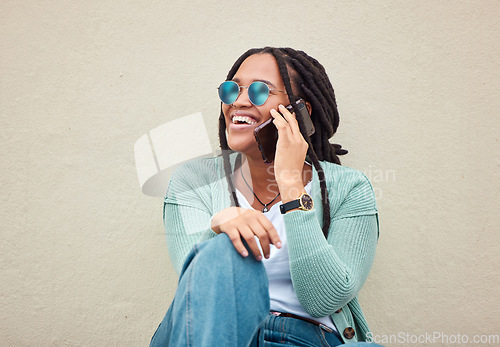 Image of Black woman, phone call and sunglasses by wall in city, happy and smile with fashion in summer. Young gen z, african student girl or smartphone for travel, urban adventure or aesthetic with happiness