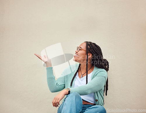 Image of Happy, black woman and hands pointing to mockup for advertising, space or wall background. Smile, hand gesture and girl excited on product placement, idea or marketing copy space, relax and isolated