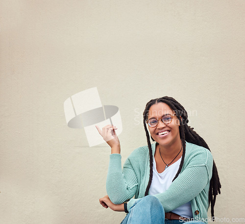 Image of Black woman, portrait and hands pointing to mockup, advertising or empty background, laugh and excited. Hand gesture, face and girl relax in studio while showing wall copy space or isolated marketing