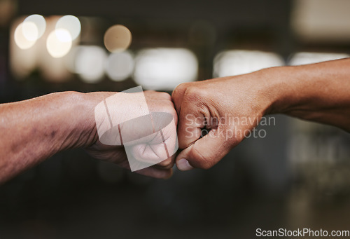 Image of Hands, fist bump and fitness motivation for sports, greeting or team building in gym for wellness. Athlete men, friends partnership and support, agreement and collaboration, success and teamwork.