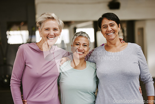 Image of Elderly woman, exercise group and portrait with hug, smile and support for wellness goal. Senior women, team building and happiness at gym for friends, solidarity or diversity for teamwork motivation