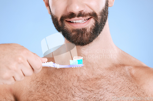 Image of Brushing teeth, studio face and man with toothbrush, dental wellness and healthy mouth care. Happy male model, oral cleaning and smile for fresh breath, facial happiness and toothpaste for cosmetics