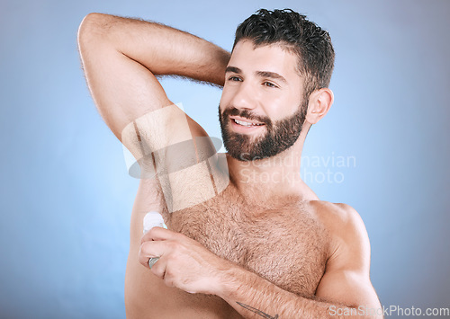 Image of Deodorant, skincare roll and man in studio grooming for hygiene, fresh scent and perfume. Male model, armpit and cosmetics for sweat control, body odor and cleaning product for beauty on background