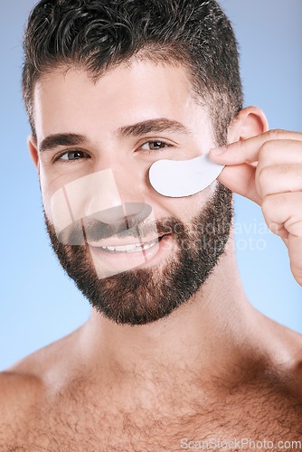 Image of Beauty patch, eyes and portrait of man in studio for dermatology, skincare and glow. Male model, face and eye care product for body mask, healthy cosmetics and wellness of facial collagen treatment