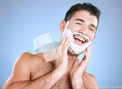 Image of Facial, shaving cream on beard and man with smile, hands on face and product placement in studio mock up. Luxury shave foam, hair and skincare, happy male model grooming isolated on blue background.