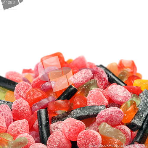 Image of Photo of colored candies over white background