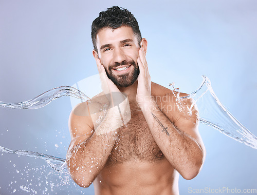 Image of Water splash, skin care and man portrait for clean spa facial for beauty, hygiene and dermatology. Aesthetic model person on blue background for health and wellness cosmetics mockup, body and detox