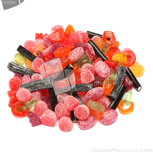 Image of Photo of colored candies over white background