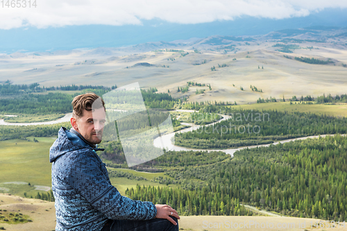 Image of Relaxing man in Kurai steppe on North-Chui ridge