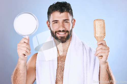 Image of Portrait, hair and mirror by man in studio for styling, treatment and product advertising on gradient background. Face, haircare and male model relax for brushing, hairstyle or grooming and isolated