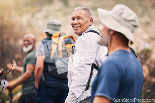 Image of Hiking, nature and senior friends on mountain for fitness, trekking and backpacking adventure. Explorer, discovery and expedition with group of old men on trail for health, retirement and journey