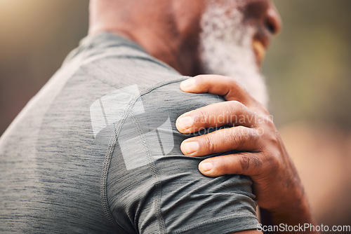 Image of Shoulder pain, injury and hand of senior black man after fitness accident outdoors. Sports, training and elderly male with fibromyalgia, inflammation or arthritis, broken bones or painful muscles.