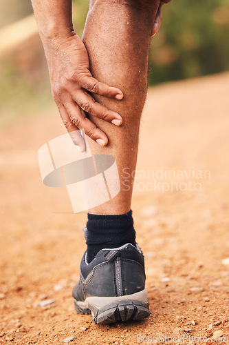 Image of Leg pain, injury and hands of senior black man after hiking accident outdoors. Sports, training hike or elderly male with fibromyalgia, legs inflammation or arthritis, broken bones or painful muscles