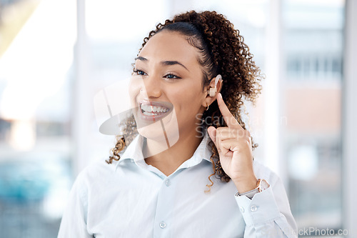 Image of Happy, deaf and black woman with cochlear implant in office for communication, translation and speech on blurred background. Disability, hearing and female employee for sign language, hand or gesture