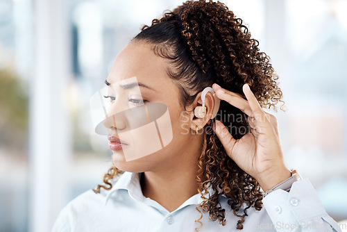 Image of Hearing aid, black woman and deaf ear and technology device to listen, communication and support. Face of person with healthcare, health insurance and sound problem with audio object and innovation