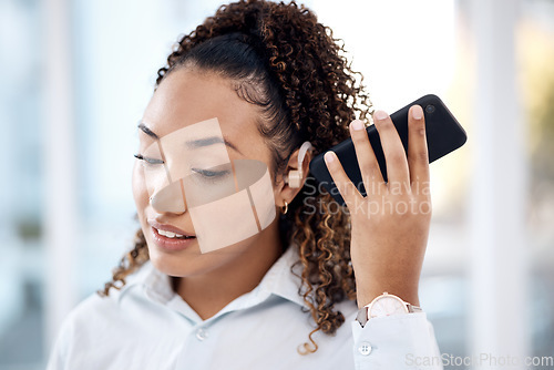 Image of Black woman, phone call and loudspeaker to listen in office with hearing aid for corporate communication. Young executive, smartphone accessibility and disability in workplace with networking
