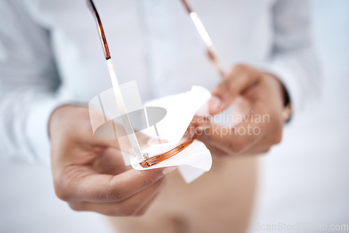 Image of Hands, woman and cleaning dust of glasses with fabric tissue for protection, sight and eyes. Person, microfiber cloth and wipe spectacles, frames and eyewear for clear vision, reading and lens care