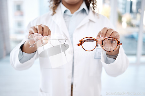 Image of Eye care, vision and woman, choice of glasses in hands, optometrist and healthcare for eyes with doctor. Prescription lens, designer frame and eyewear decision, health insurance and optometry