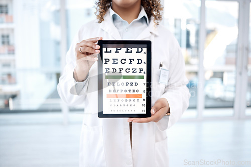 Image of Hands, optometry chart and tablet screen in hospital for vision examination in clinic. Healthcare, snellen or woman, ophthalmologist or medical doctor holding technology showing letters for eye test.