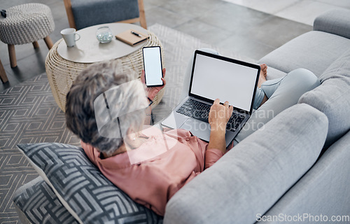Image of Woman, phone and laptop with mockup media on sofa, screen and living room connection for social networking. Female, home and mock up technology space for digital download, online contact and search