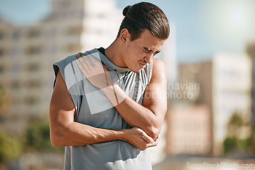 Image of Fitness, shoulder pain and man with injury after workout, exercise or training accident in city. Sports, health and male athlete with fibromyalgia, muscle inflammation or arthritis and broken bones.