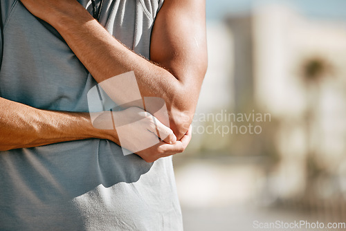 Image of Holding, fitness and man with arm pain after training, broken bone and sprain after exercise in city. Emergency, sports and athlete runner with a body accident, muscle strain and injured in Spain