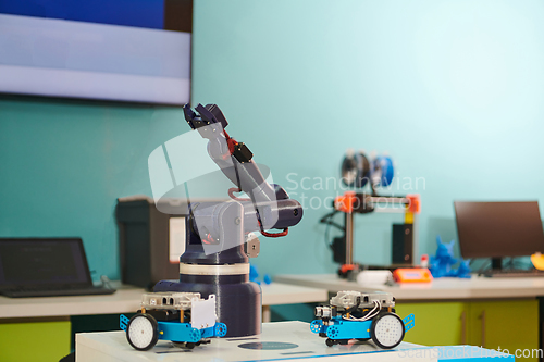 Image of Modern equipment for robotics and a 3d printer for modeling on a table in a laboratory