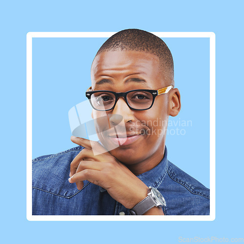 Image of Portrait, frame or black man with happiness, achievement or opportunity with success on blue studio background. Face, border or African American male with confidence, smile or celebration on backdrop