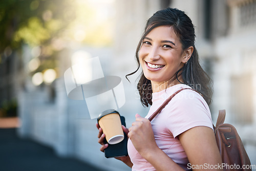Image of Travel, portrait and happy woman by a city building with freedom on a urban adventure in Italy. Relax, smile and morning coffee of a young person on vacation with happiness and blurred background