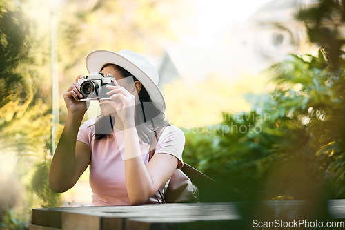 Image of Photography, memory and woman with a camera in nature during travel in Singapore. Vacation, tourism and professional ecology photographer in a botanical garden to capture the natural environment