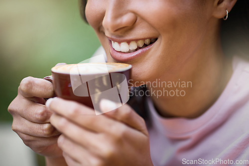 Image of Happy, closeup and woman relax with coffee, content and satisfied on a blurred background. Smile, zoom and hands of girl with tea at outdoor cafe, peaceful and calm while enjoying off day or weekend