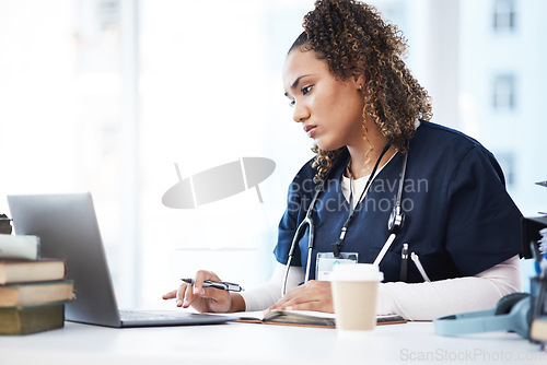 Image of Medical, laptop and research with a woman nurse reading information in a hospital for diagnosis. Healthcare, insurance and education with a female med student working in a clinic for data analysis