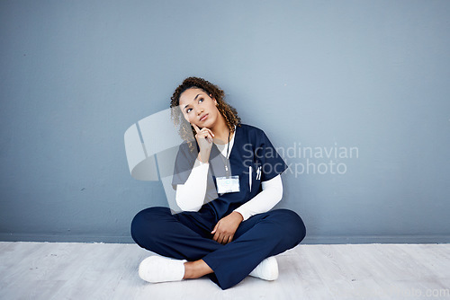 Image of Nurse, sitting or thinking of hospital treatment, medicine innovation or surgery planning on mock up wall. Doctor, woman or healthcare worker and ideas, vision or decision for wellness life insurance