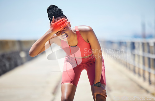 Image of Headache, fever and black woman runner by the sea with fitness, training and running injury. Head pain, sports and athlete with joint, muscle and inflammation problem with blurred background