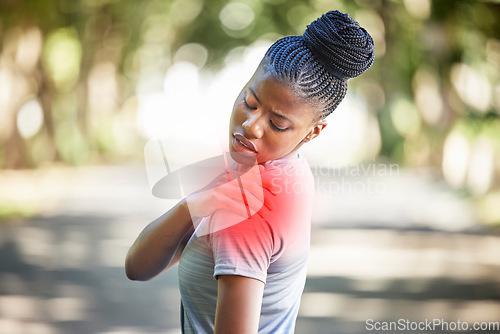 Image of Sports, health and woman with shoulder injury, pain or accident while running in a park. Fitness, workout and African female athlete with a medical emergency or sprain muscle after a cardio exercise.