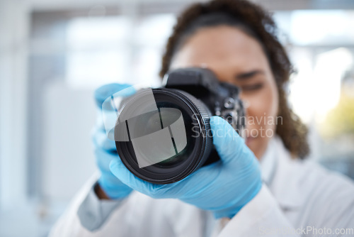 Image of Camera, photography and lens with black woman in forensics laboratory for investigation, crime scene and evidence. Research, analytics and observation with girl and digital pictures for science