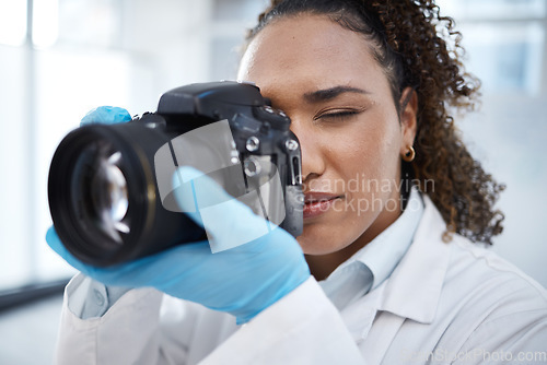 Image of Camera, photography and medical with black woman in forensics laboratory for investigation, crime scene and evidence. Research, analytics and observation with girl and digital pictures for science