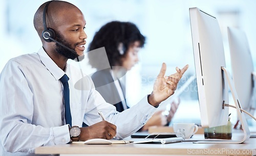 Image of Call center, business and black man with computer, telemarketing or talking to help with tech support. Corporate, African American male employee or consultant with headset, conversation and workplace