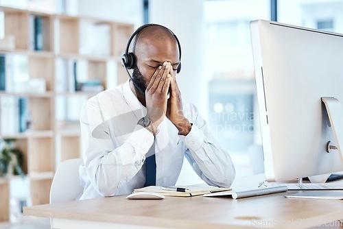 Image of Anxiety, depression and burnout by call center worker, employee and customer service consultant in office. Pain, mental health and telemarking agent overworked and frustrated at the workplace