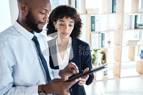 Image of Black man, woman and tablet in office for teamwork, analysis and planning schedule at startup. Executive assistant, boss and mobile touchscreen for discussion, strategy or goal at web design company