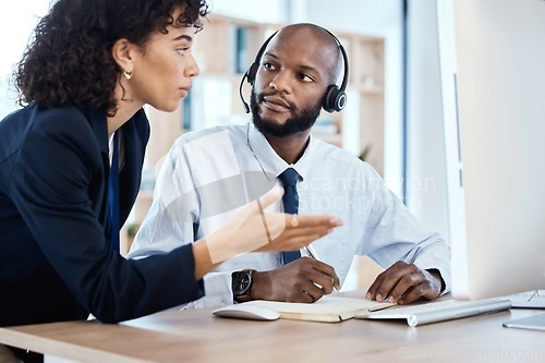 Image of CRM, customer service or teamwork writing notes for coaching, consulting or networking in office. Call center, learning or black man and woman on tech for telemarketing, research or strategy support