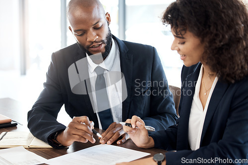 Image of Business, black man and advisor consulting with paperwork, review report or portfolio documents. Teamwork, consultant and meeting for executive analysis, planning legal feedback or consultation notes