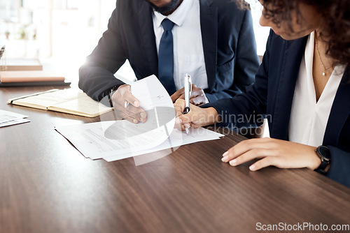 Image of Lawyer, hands and contract with a business team at a desk in an office to sign documents. Teamwork, meeting or financial advisor with a man and woman employee signing paperwork in agreement of a deal